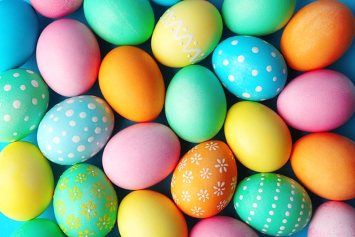 Colorful beeping Easter eggs on a blue background.